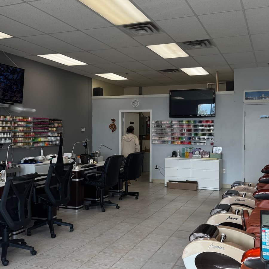 Manicure stations and pedicure chairs inside Great Nails
