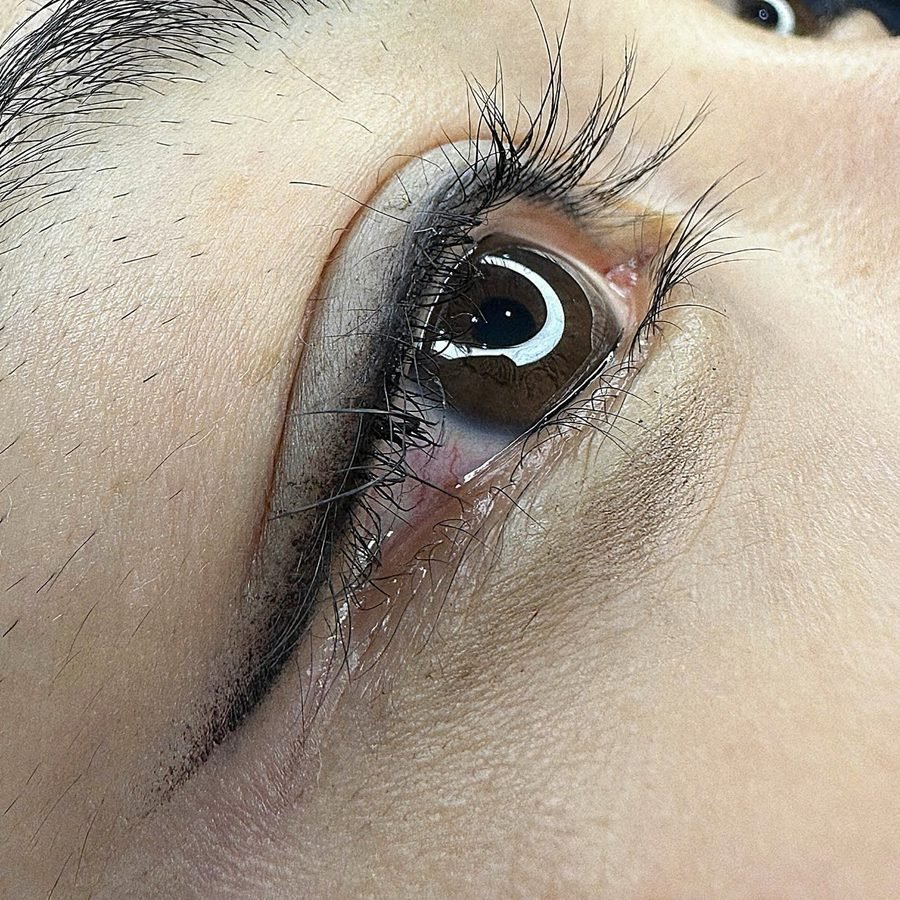 Close-up of permanent eyeliner along the lash line