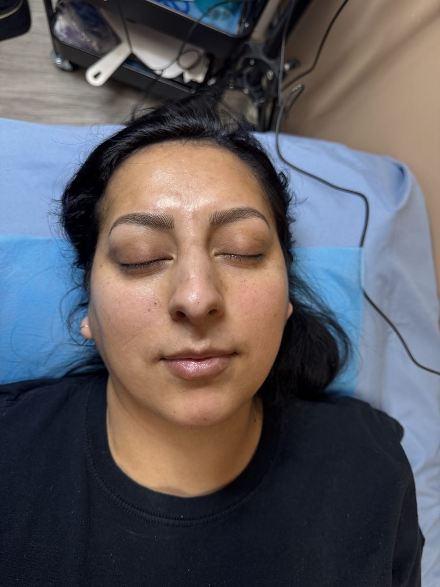 Nano hairstroke brows on a client with closed eyes